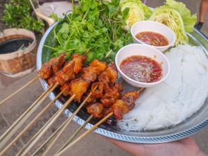 Beef tendon grilled in front of Chao Anouvong Stadium