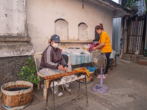 Beef tendon grilled in front of Chao Anouvong Stadium